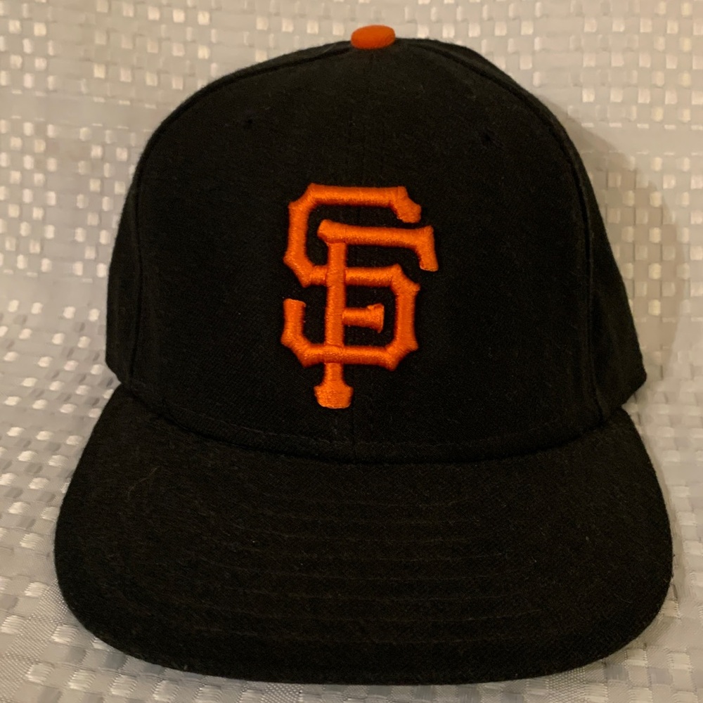 San Francisco Giants New Era black baseball cap with orange logo,size 7 and 1/8.